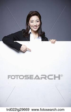 woman holding paper board View Large Photo Image Stock Photo - woman holding paper board. Fotosearch