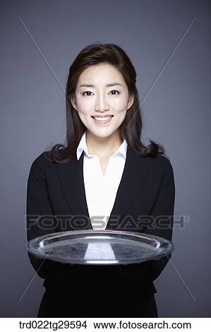 woman holding tray View Large Photo Image Picture - woman holding tray. Fotosearch
