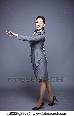 Stock Photography - woman stretched her arm out. Fotosearch