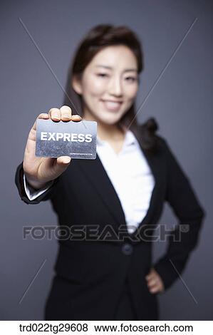Stock Photo - woman stretched her card out. Fotosearch