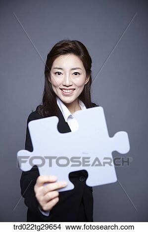 woman stretched puzzle piece out View Large Photo Image Picture - woman stretched puzzle piece out. Fotosearch