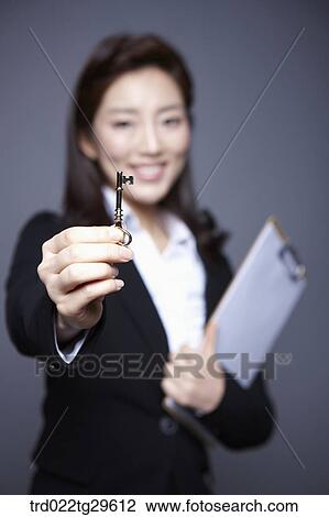 woman stretched the key out View Large Photo Image Stock Image - woman stretched the key out. Fotosearch