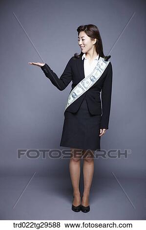 Stock Photo - woman wearing money band. Fotosearch