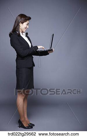 woman working by using laptop View Large Photo Image Stock Image - woman working by using laptop. Fotosearch