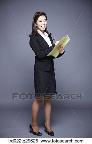 woman writing something on the file View Large Photo Image Stock Photograph - woman writing something on the file. Fotosearch