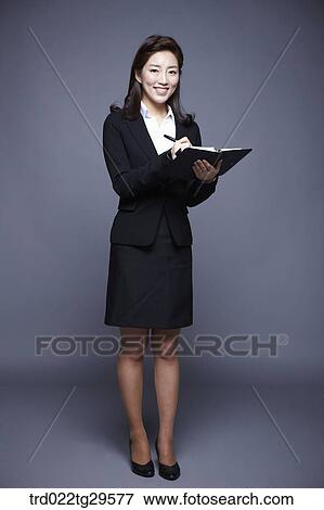 woman writing something on the notebook View Large Photo Image Stock Photo - woman writing something on the notebook. Fotosearch