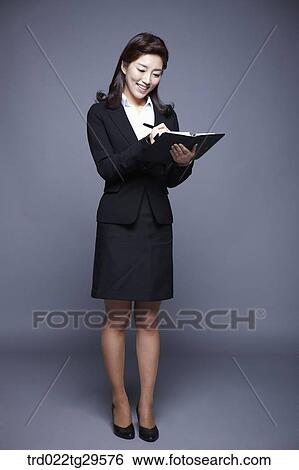 woman writing something on the notebook View Large Photo Image Stock Photograph - woman writing something on the notebook. Fotosearch