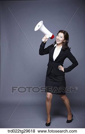 woman yelling to loud speaker View Large Photo Image Stock Photo - woman yelling to loud speaker. Fotosearch