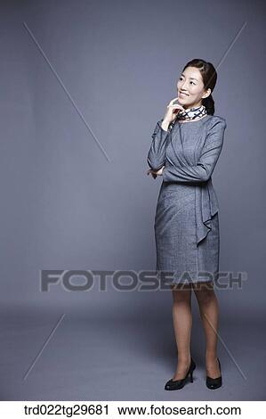 Stock Image - woman's chin in hands. Fotosearch