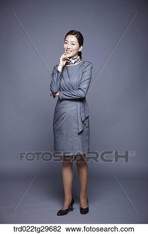 Stock Image - woman's chin in hands. Fotosearch