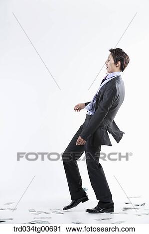 A man hard to stand and flying money View Large Photo Image Stock Image - A man hard to stand and flying money. Fotosearch