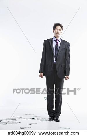 A man hard to stand and flying money View Large Photo Image Stock Photo - A man hard to stand and flying money. Fotosearch