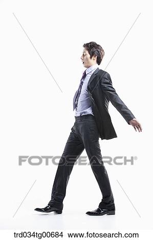 A man hard to walk forward hit by the wind View Large Photo Image Picture - A man hard to walk forward hit by the wind. Fotosearch