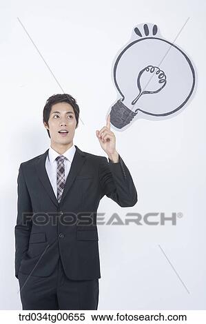 A man pointing the bulb View Large Photo Image Stock Photography - A man pointing the bulb. Fotosearch