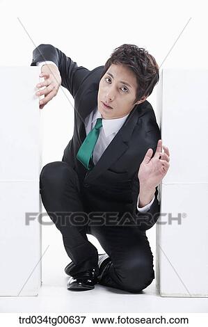 A man stuck between the piled boxes View Large Photo Image Stock Photo - A man stuck between the piled boxes. Fotosearch
