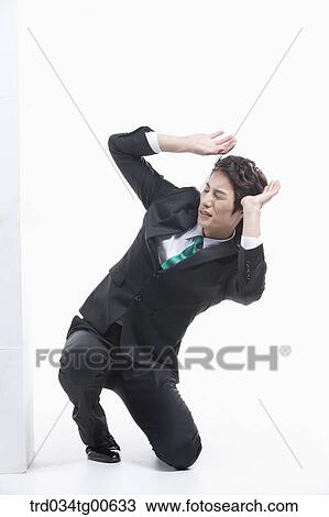 A man surprised by the piled boxes View Large Photo Image Stock Image - A man surprised by the piled boxes. Fotosearch