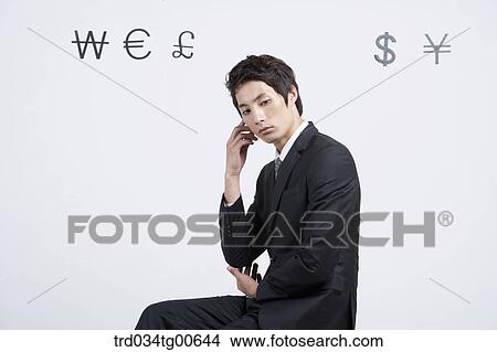 A man with foreign currency around View Large Photo Image Picture - A man with foreign currency around. Fotosearch