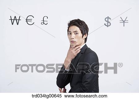 A man with foreign currency around View Large Photo Image Stock Photography - A man with foreign currency around. Fotosearch
