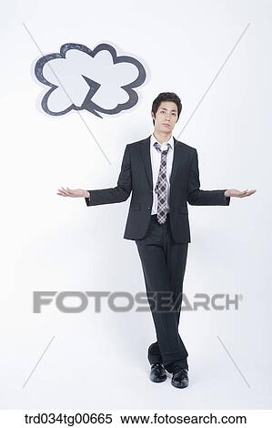 Stock Photography - A stressful man having his arms open with dark lightening cloud. Fotosearch