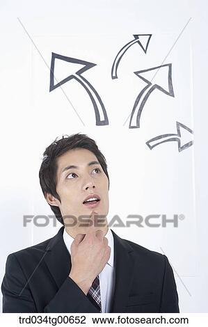 A thinking man having a finger on his chin with rising arrows View Large Photo Image Stock Image - A thinking man having a finger on his chin with rising arrows. Fotosearch