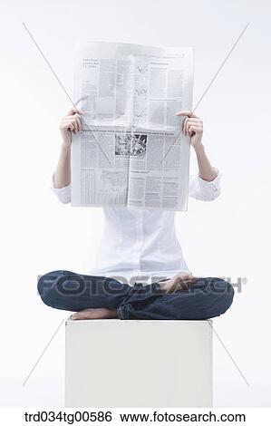A woman reading newspaper View Large Photo Image Stock Photograph - A woman reading newspaper . Fotosearch