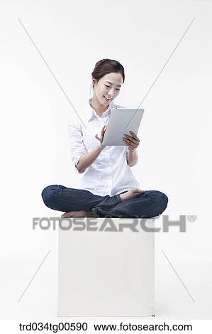 A woman touching the monitor of tablet PC View Large Photo Image Stock Image - A woman touching the monitor of tablet PC. Fotosearch