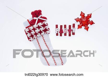 The Christmas stocking with red party clips and snowflake View Large Photo Image Stock Image - The Christmas stocking with red party clips and snowflake. Fotosearch