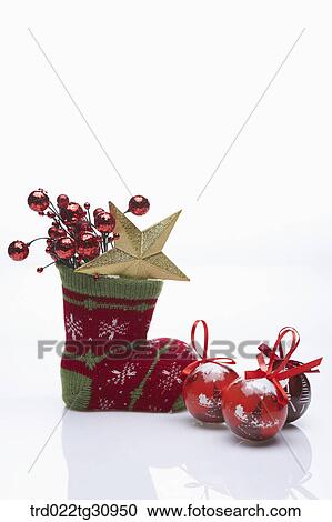 The gold star in green and red Christmas stocking with red Christmas balls View Large Photo Image Stock Image - The gold star in green and red Christmas stocking with red Christmas balls. Fotosearch