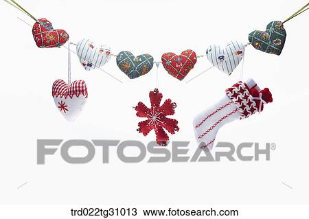 The quilted heart, snowflake, Christmas stocking decorations hung upon patched heart decoration View Large Photo Image Stock Image - The quilted heart, snowflake, Christmas stocking decorations hung upon patched heart decoration . Fotosearch