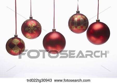 Stock Image - The red and gold Christmas ball decorations. Fotosearch