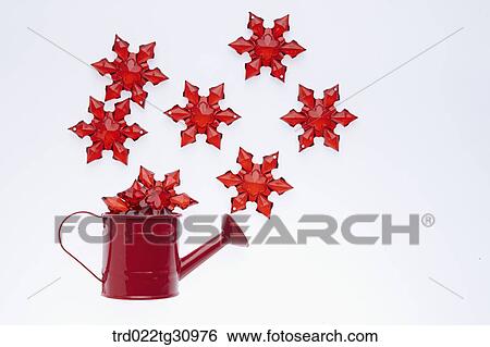 The red snowflake in red watering can with red snowflake around View Large Photo Image Stock Photograph - The red snowflake in red watering can with red snowflake around. Fotosearch
