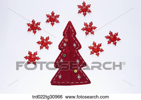 Stock Photograph - The red tree with red snowflake. Fotosearch