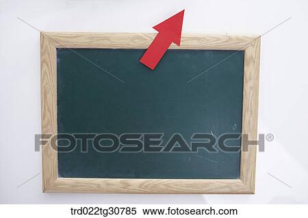 Stock Photography - A black board with a red arrow pointng up. Fotosearch
