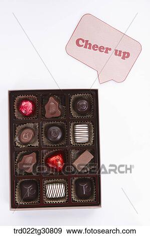Stock Photo - A box of chocolate and cheer up message. Fotosearch