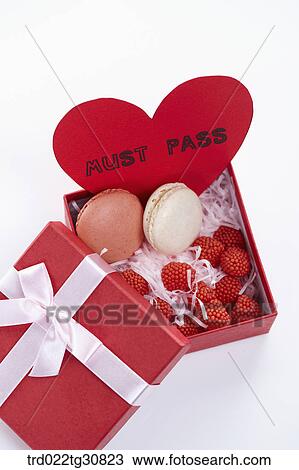 Stock Image - A box of sweets and a MUST PASS message. Fotosearch