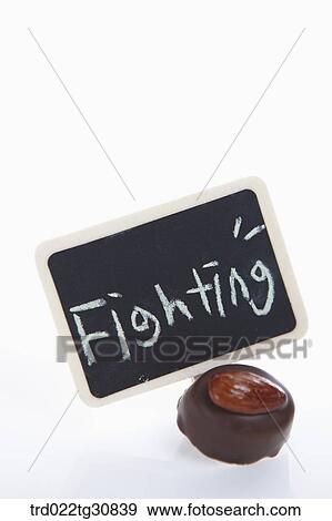 A chocolate with a fighting message board View Large Photo Image Stock Photo - A chocolate with a fighting message board. Fotosearch