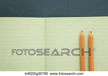 An open notebook with orange pencils View Large Photo Image Stock Image - An open notebook with orange pencils. Fotosearch