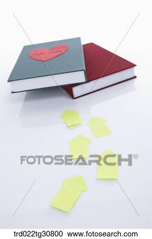 Stock Image - Arrows toward books. Fotosearch