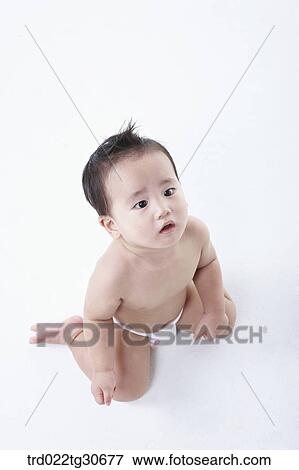 Baby boy in nappy View Large Photo Image Stock Photo - Baby boy in nappy. Fotosearch