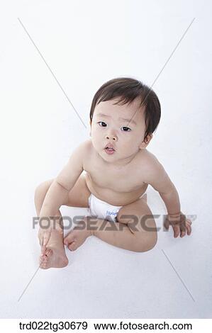 Baby boy in nappy View Large Photo Image Stock Photo - Baby boy in nappy. Fotosearch
