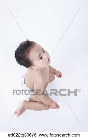 Stock Photograph - Baby boy in nappy. Fotosearch