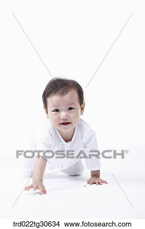 Picture - Baby boy in white clothes. Fotosearch