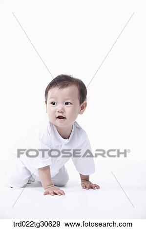 Baby boy in white clothes View Large Photo Image Stock Photo - Baby boy in white clothes. Fotosearch