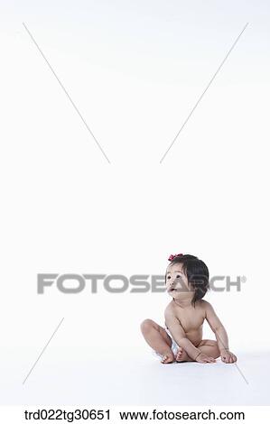 Stock Image - Baby girl in nappy. Fotosearch