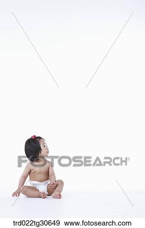 Stock Photo - Baby girl in nappy. Fotosearch