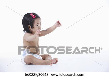 Baby girl in nappy View Large Photo Image Stock Photo - Baby girl in nappy . Fotosearch