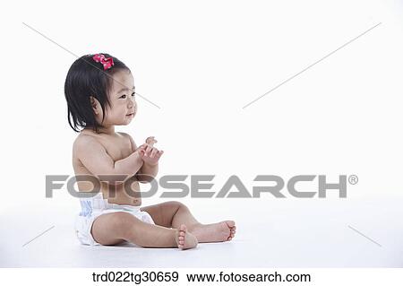 Stock Photo - Baby girl in nappy . Fotosearch
