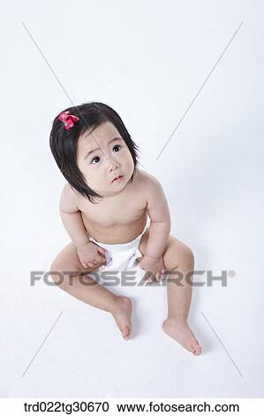 Baby girl in nappy with red ribbon View Large Photo Image Stock Image - Baby girl in nappy with red ribbon. Fotosearch