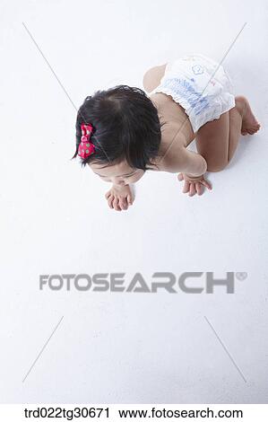 Baby girl in nappy with red ribbon View Large Photo Image Stock Image - Baby girl in nappy with red ribbon. Fotosearch