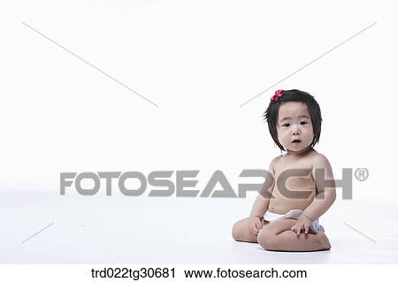 Baby girl in nappy with red ribbon View Large Photo Image Stock Image - Baby girl in nappy with red ribbon. Fotosearch